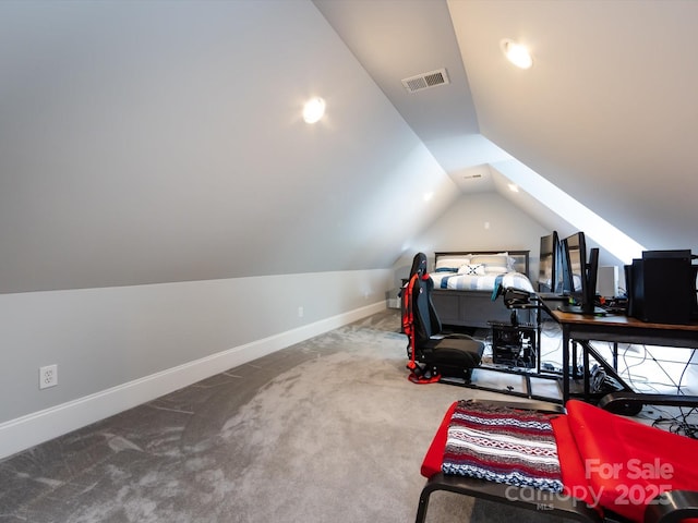 carpeted bedroom featuring lofted ceiling