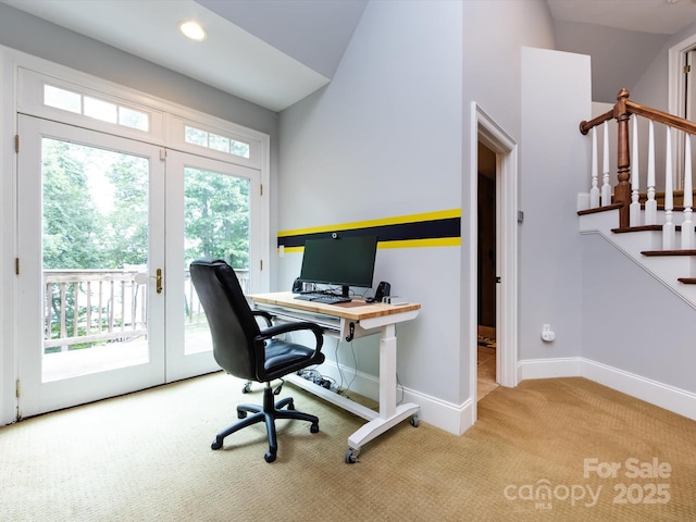 office space featuring vaulted ceiling, light colored carpet, and french doors