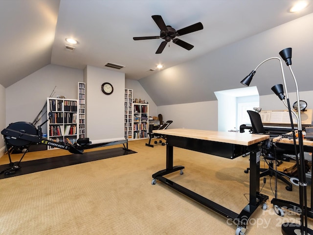 workout room with lofted ceiling, light colored carpet, and ceiling fan