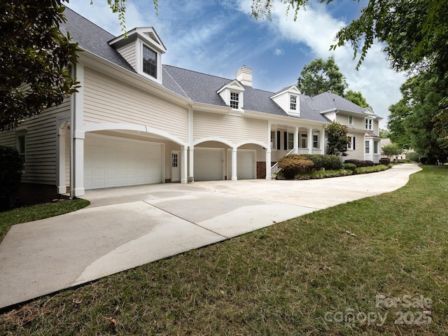 cape cod house with a garage and a front yard