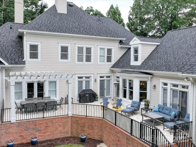 rear view of house with outdoor lounge area