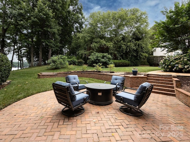 view of patio featuring a fire pit