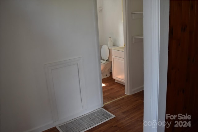 hall with dark wood-type flooring