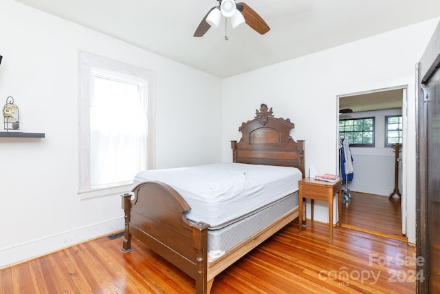 bedroom featuring hardwood / wood-style floors and ceiling fan