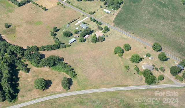 birds eye view of property featuring a rural view