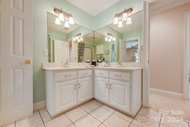 bathroom featuring tile patterned floors, ceiling fan, and vanity