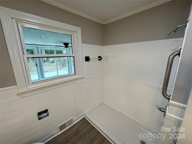 bathroom featuring wood-type flooring, ceiling fan, and walk in shower