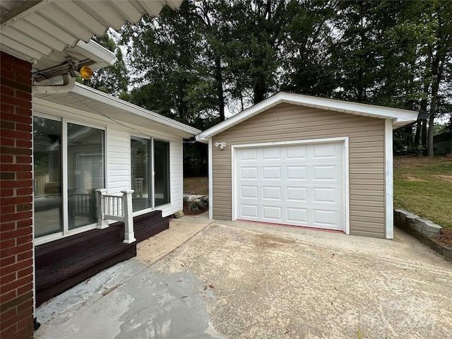 garage featuring wood walls