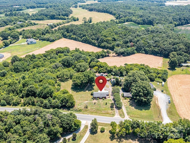 birds eye view of property with a rural view