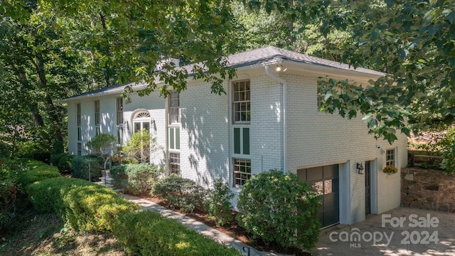 view of property exterior with a garage