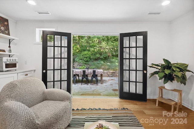 doorway to outside featuring light wood-type flooring