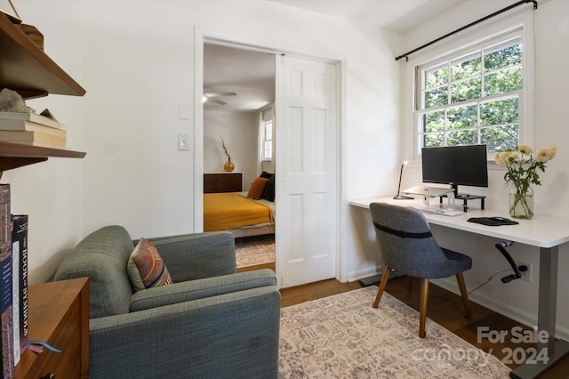 office with hardwood / wood-style flooring and ceiling fan