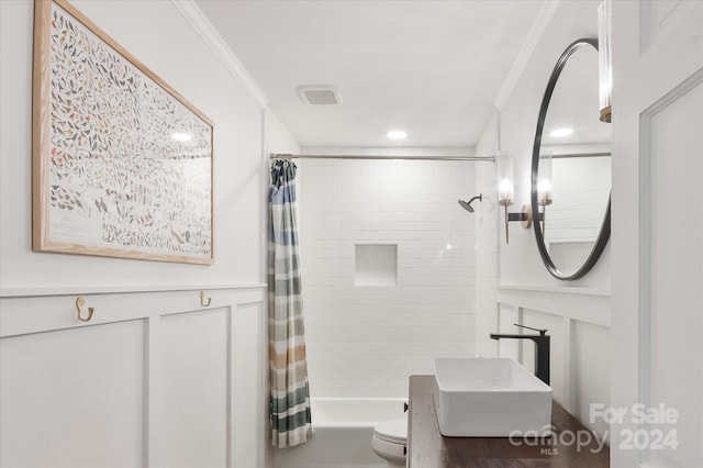 full bathroom with shower / tub combo, sink, ornamental molding, and toilet