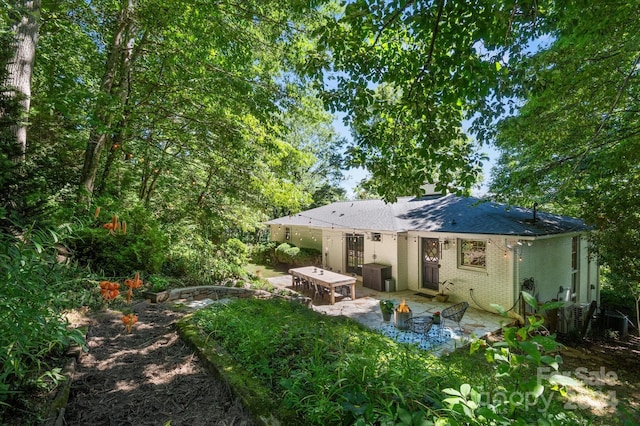 rear view of property with a patio area