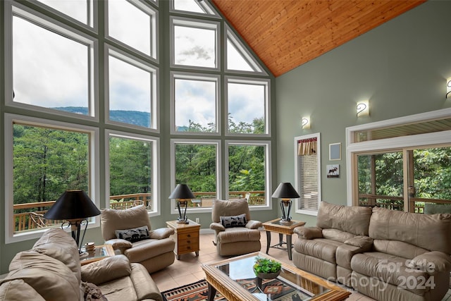 living room with tile patterned flooring, high vaulted ceiling, and wood ceiling