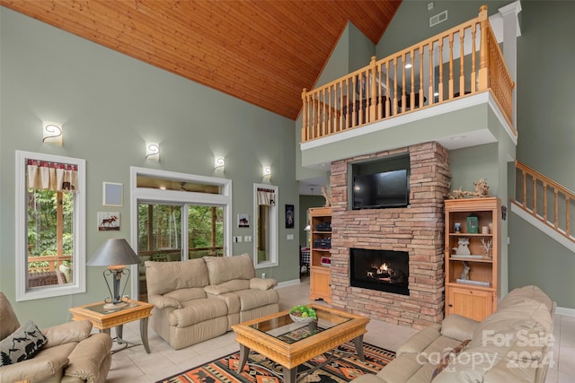 tiled living room with a stone fireplace, wooden ceiling, and high vaulted ceiling