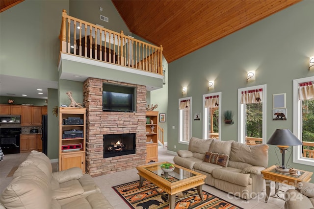 living room with a stone fireplace, high vaulted ceiling, wooden ceiling, and light tile patterned floors