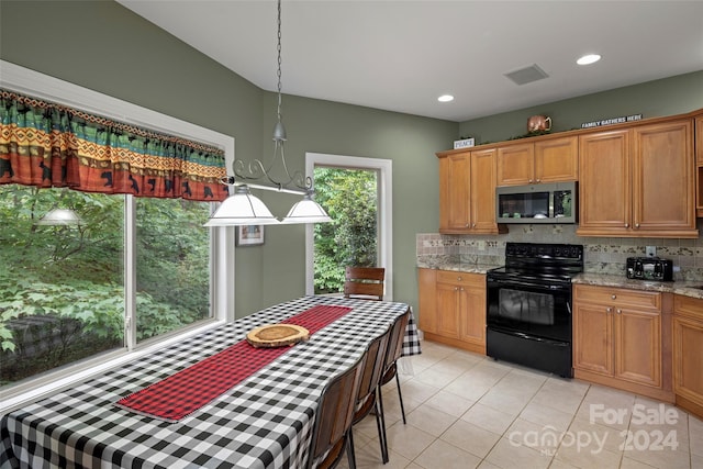 kitchen with light stone counters, black range with electric stovetop, backsplash, and light tile patterned floors