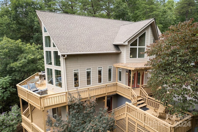 back of house featuring a wooden deck