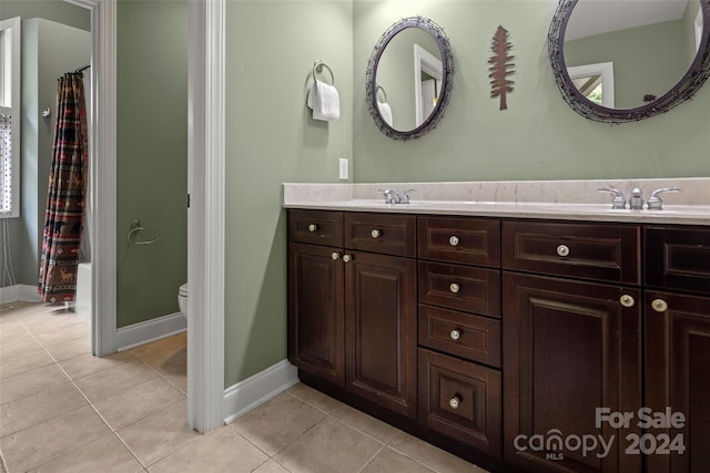 full bathroom with tile patterned flooring, vanity, toilet, and shower / bathtub combination with curtain