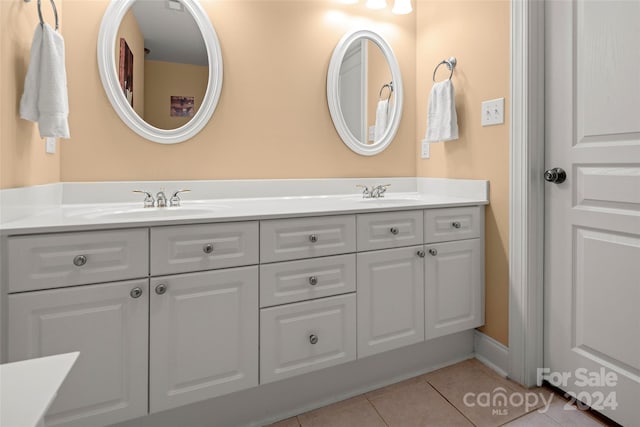 bathroom with tile patterned floors and vanity