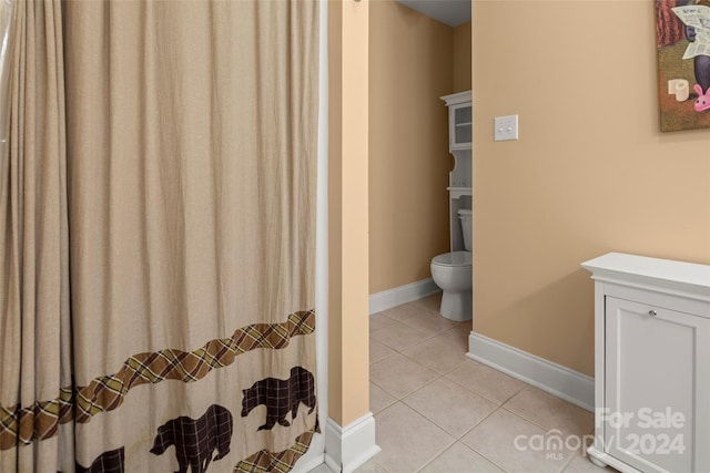 bathroom with tile patterned floors