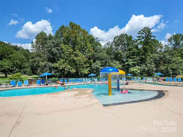 view of swimming pool with a patio area and pool water feature