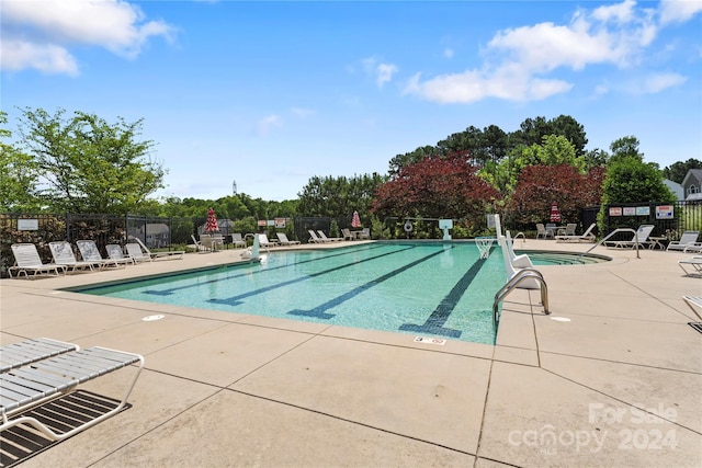 view of pool featuring a patio