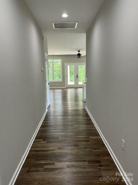 hallway with dark hardwood / wood-style floors