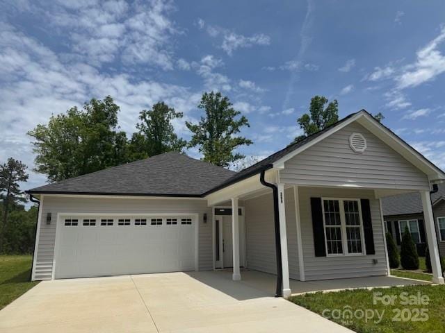 209 Eagles Lndg, Morganton, NC 28655 - ranch-style home with concrete driveway, a garage, and covered porch