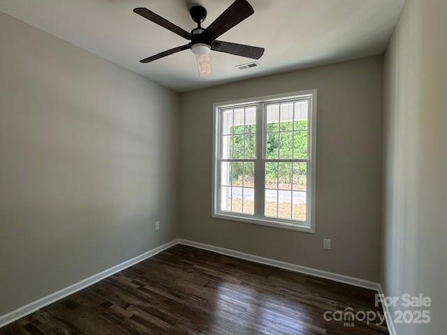 209 Eagles Lndg, Morganton, NC 28655 - spare room featuring baseboards, dark wood-style floors, and a ceiling fan