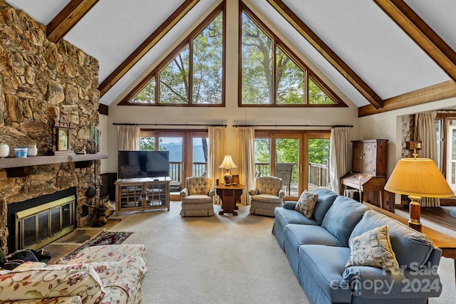 carpeted living room featuring a fireplace, high vaulted ceiling, and beamed ceiling