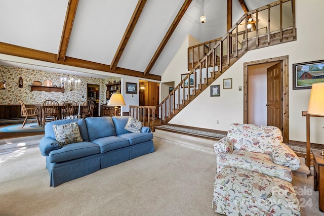 living room with beam ceiling, high vaulted ceiling, and carpet