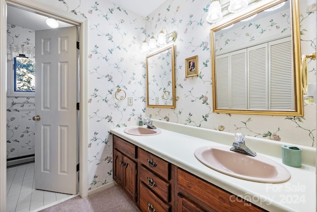 bathroom featuring tile patterned flooring and dual vanity