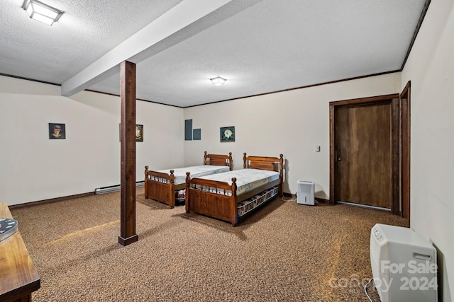 bedroom with beam ceiling, carpet, and a textured ceiling