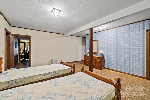 bedroom with carpet and a textured ceiling