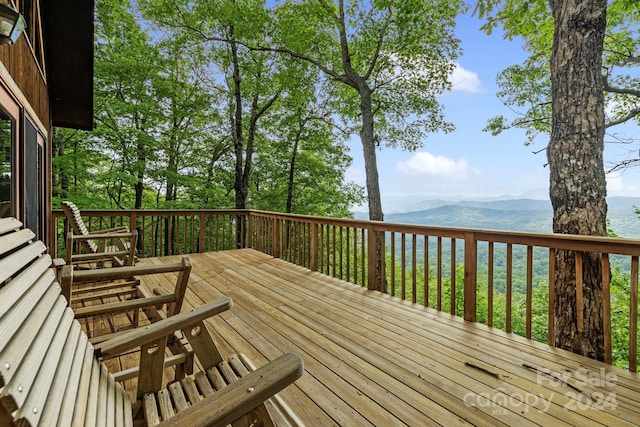 wooden terrace with a mountain view