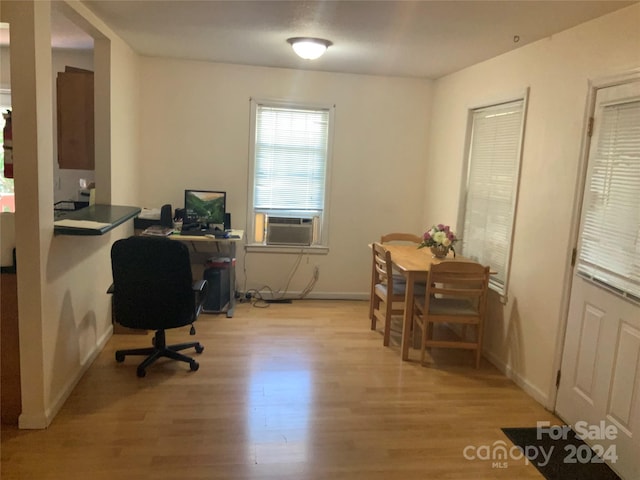 office featuring light wood-type flooring and cooling unit