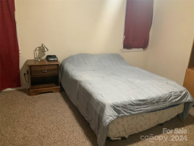 bedroom with light carpet