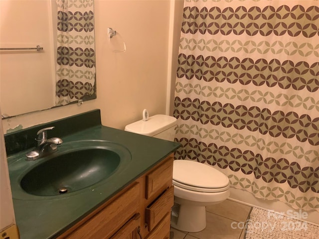 bathroom with tile patterned flooring, vanity, toilet, and a shower with shower curtain