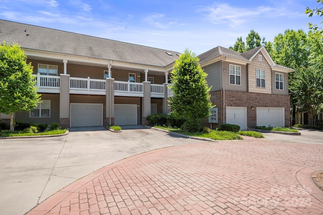 view of front of home featuring a balcony