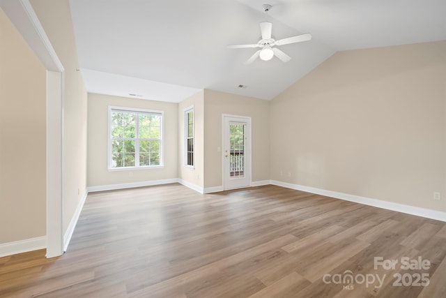 unfurnished living room featuring lofted ceiling, light hardwood / wood-style flooring, and ceiling fan