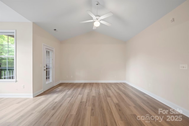 unfurnished room featuring vaulted ceiling, ceiling fan, and light hardwood / wood-style flooring