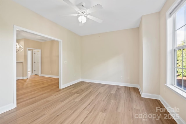 empty room featuring light hardwood / wood-style floors and ceiling fan