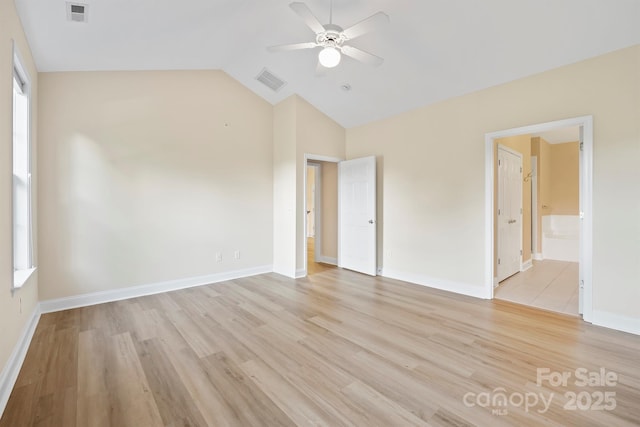 unfurnished room featuring vaulted ceiling, ceiling fan, and light wood-type flooring