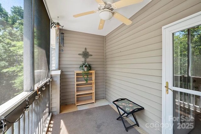 sunroom / solarium with ceiling fan