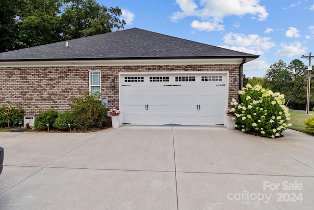 view of property exterior with a garage