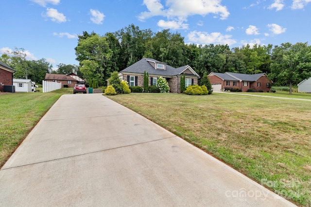 single story home with a front yard