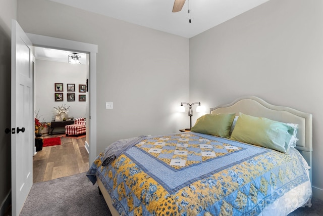 bedroom featuring ceiling fan and hardwood / wood-style floors