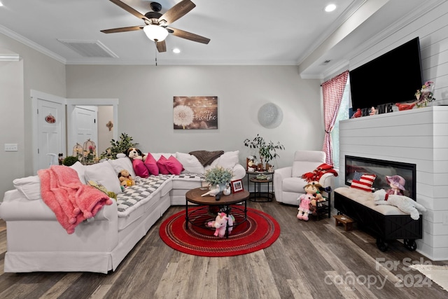 living room featuring ceiling fan, dark hardwood / wood-style flooring, and ornamental molding